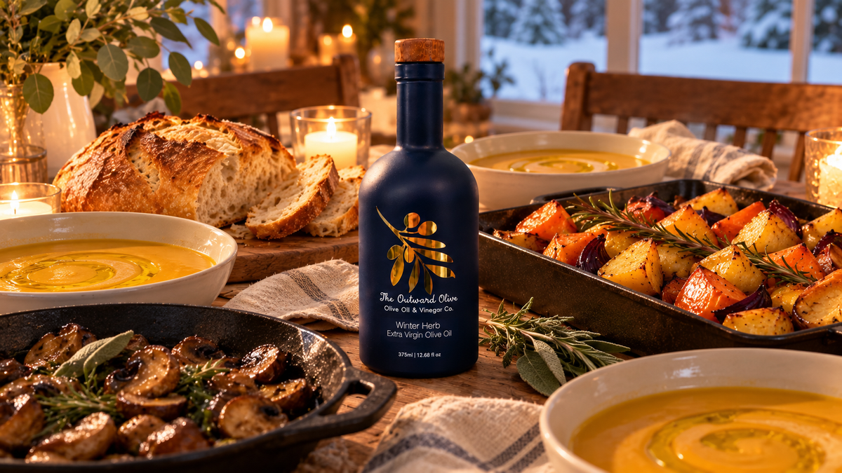 Winter dinner table with Winter Herb Extra Virgin Olive Oil, soup, bread and roasted vegetables